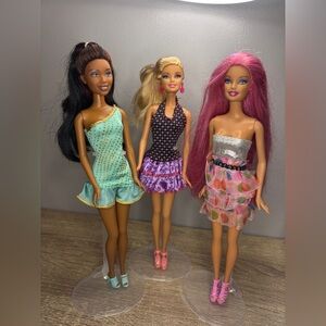 Three Early Y2K Barbies